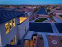 A well-maintained neighborhood featuring landscaped yards and a serene atmosphere at dusk at 6289 Redstone Hills Dr, Las Vegas, NV 89148