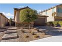 House exterior showcasing a landscaped front yard and walkway at 6333 Supernova Hill St, North Las Vegas, NV 89031