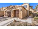 Two-story house with three-car garage and stone accents at 6737 Fast Brook Ct, North Las Vegas, NV 89084