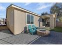 Cozy backyard patio with fire pit and seating at 7017 Solana Ridge Dr, North Las Vegas, NV 89084