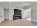 Modern fireplace with dark stone surround in living room at 7305 Backstretch Ave, Las Vegas, NV 89130