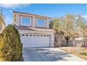 Two-story house with a two-car garage and mature trees at 7645 Rustic Galleon St, Las Vegas, NV 89139