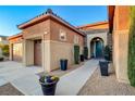 Well-maintained house with a two-car garage and inviting entryway at 8970 Rancho Durango Ct, Las Vegas, NV 89148