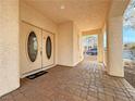 Brick paved porch with double doors leading into the home at 8971 Dallas Ridge Ave, Las Vegas, NV 89178