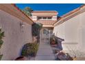 Front entry with wrought iron gate, leading to the house at 9520 Sundial Dr, Las Vegas, NV 89134