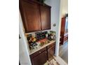 Home wet bar with wine rack and granite countertop at 9545 Belmont Bay Ave, Las Vegas, NV 89148