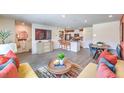 Open concept living and dining area with modern kitchen and island at , North Las Vegas, NV 89084