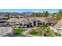 One-story home with mountain views and attractive landscaping at 10032 Fox Springs Dr, Las Vegas, NV 89117