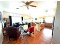 Spacious living room featuring hardwood floors and an open floor plan at 1060 Gallant Fox Ave, Henderson, NV 89015