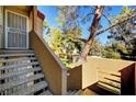 Exterior stairs leading to condo entrance with trees at 3145 E Flamingo Rd # 2122, Las Vegas, NV 89121