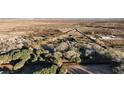 Aerial view shows expansive property with a house and pond at 4255 W State Highway 168, Moapa, NV 89025