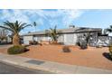 Newly painted house with mature palm trees at 4818 El Tesoro Ave, Las Vegas, NV 89121