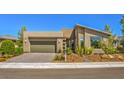 Single story home with attached garage and desert landscaping at 4884 E Cactus Canyon Dr, Pahrump, NV 89061