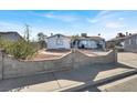 Single-story home with a landscaped front yard and a concrete driveway at 5453 Waltham Ln, Las Vegas, NV 89122