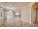 Spacious dining room with tile floors and crown molding at 6336 Fence Post St, Las Vegas, NV 89148