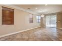 Bright dining room featuring tile floors and large windows at 6336 Fence Post St, Las Vegas, NV 89148