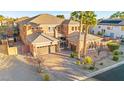 Two-story home with attached garage and spacious driveway; manicured landscaping at 7258 Sashaying Spirit Ct, Las Vegas, NV 89131