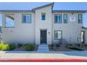 Contemporary townhome exterior with a front entrance and landscaping at 7322 N Decatur Blvd # 1, Las Vegas, NV 89131