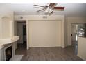 Living room with hardwood floors, fireplace, and view of bathroom and balcony at 9050 W Warm Springs Rd # 2049, Las Vegas, NV 89148