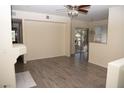 Living room with hardwood floors, fireplace, and access to balcony at 9050 W Warm Springs Rd # 2049, Las Vegas, NV 89148