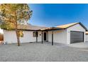 Newly renovated single story home with modern finishes and landscaping at 1208 Marion Dr, Las Vegas, NV 89110