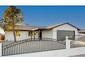 Updated single story home with a new fence and driveway at 1208 Marion Dr, Las Vegas, NV 89110