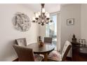 Charming dining area with a round table, four chairs, and city views at 2747 Paradise Rd # 1104, Las Vegas, NV 89109