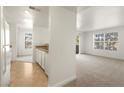 Living room, kitchen and dining area with light colored carpet at 2801 N Rainbow Blvd # 235, Las Vegas, NV 89108