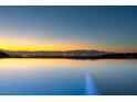 Infinity pool with breathtaking panoramic city views at sunset at 49 Vista Outlook St, Henderson, NV 89011