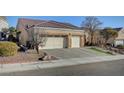 Single-story house with three-car garage and desert landscaping at 5908 Aqua Verde St, North Las Vegas, NV 89031