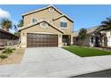 Two-story house with brown garage door and artificial turf at 5912 Royal Castle Ln, Las Vegas, NV 89130