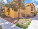 A charming condo building showcasing a well-maintained facade and manicured landscaping at 5915 Nuevo Leon St # 7, North Las Vegas, NV 89031