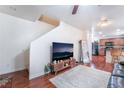 Living room with hardwood floors, TV, and view of kitchen at 6287 Felicitas Ave, Las Vegas, NV 89122