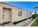 House exterior featuring a walkway and landscaping at 8113 Hercules Dr, Las Vegas, NV 89128