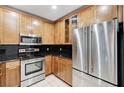 Kitchen features stainless steel appliances and light wood cabinets at 8255 S Las Vegas Bl Blvd # 718, Las Vegas, NV 89123