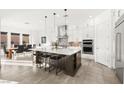 Modern kitchen featuring a large island and stainless steel appliances at 8535 Black Brush Ln, Las Vegas, NV 89131