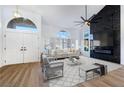 Bright living room with large windows and hardwood floors at 9 White Tail Ct, Henderson, NV 89074