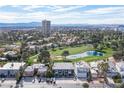 Aerial view of house on golf course with city skyline in background at 915 Vegas Valley Dr # 4, Las Vegas, NV 89109