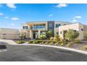 Luxury modern home with expansive windows and landscaped front yard at 9780 Solar Ave, Las Vegas, NV 89149