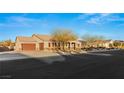 House exterior showcasing a two-car garage and landscaping at 1024 San Eduardo Ave, Henderson, NV 89002