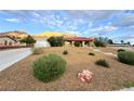 Single story home with red tile roof, desert landscaping, and mountain views at 1032 Morning Sun Way, Las Vegas, NV 89110
