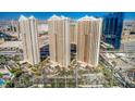 Stunning high-rise buildings with manicured landscaping, beautiful water feature and convenient circular drive at 135 E Harmon Ave # 2302, Las Vegas, NV 89109
