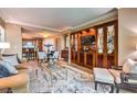 Open concept living room with a partial view of the kitchen and dining area at 135 E Harmon Ave # 2302, Las Vegas, NV 89109