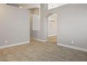 Open living area with tile floors, neutral paint, archways and ample natural light at 1905 Rose Coral Ave, Las Vegas, NV 89106