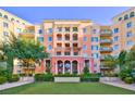 Upscale condo building with manicured lawn and inviting entrance at 30 Strada Di Villaggio # 151, Henderson, NV 89011