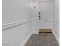 Bright hallway with neutral-colored walls and carpeting at 30 Strada Di Villaggio # 151, Henderson, NV 89011