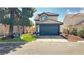Two-story house with dark blue garage door and landscaping at 3350 Stacey Lyn Dr, Las Vegas, NV 89117