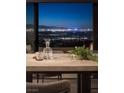 Modern dining room with stunning panoramic city views at 410 Tranquil Peak Ct, Henderson, NV 89012