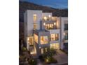 Contemporary three-story home with a sleek design and city views at 410 Tranquil Peak Ct, Henderson, NV 89012