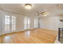 Spacious living room featuring hardwood floors and French doors leading to outdoor space at 429 Ash St, Boulder City, NV 89005